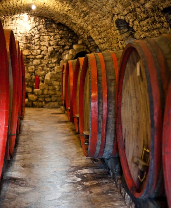 Oak wine barrels stored in the 15th century stone cellar at Tvrdos Monastery, Trebinje.