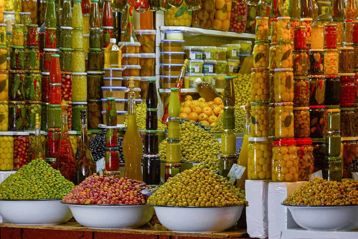 Olives for sale at a market stall in Marrakech, Morocco.