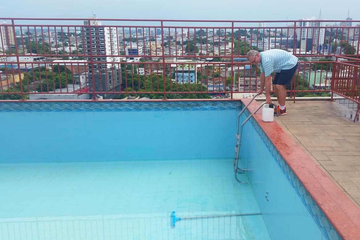 Travel writer Bernard O'Shea peers into the empty infinity pool at the Taj Mahal Continental Hotel in Manaus, Amazonas, Brazil
